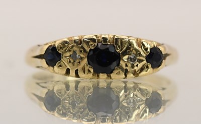 Lot 1410 - A 9ct yellow gold sapphire set ring, with...