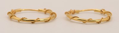 Lot 1504 - A pair of 18ct yellow gold hoop earrings with...