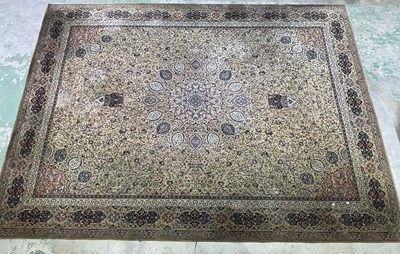 Lot 684 - A machine woven European rug, with a central...