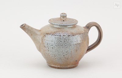 Lot 504 - PHIL ROGERS (1951-2020); a salt glazed teapot...
