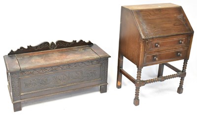 Lot 24b - A small oak carved coffer on stile feet,...