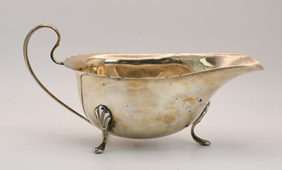 Lot 1177 - A George V hallmarked silver sauceboat,...