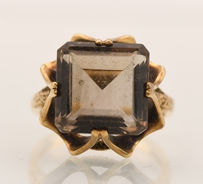 Lot 1391 - A 9ct yellow gold citrine set dress ring, the...
