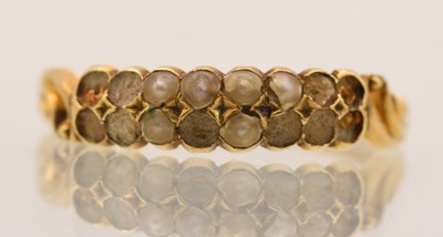 Lot 1412 - A 9ct yellow gold seed pearl set dress ring,...