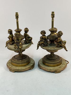 Lot 542 - A pair of 19th century gilt metal table lamps,...