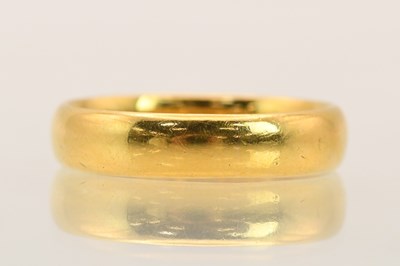 Lot 1366 - A 22ct yellow gold band ring, size O, approx 4....