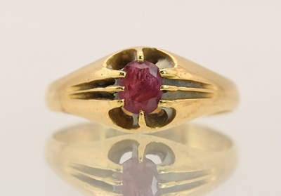 Lot 1379 - An 18ct yellow gold single ruby set ring, size...