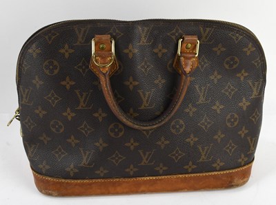 Lot 653 - LOUIS VUITTON; a vintage brown monogram...