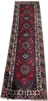 Lot 683 - A hand woven Persian style runner, with a...