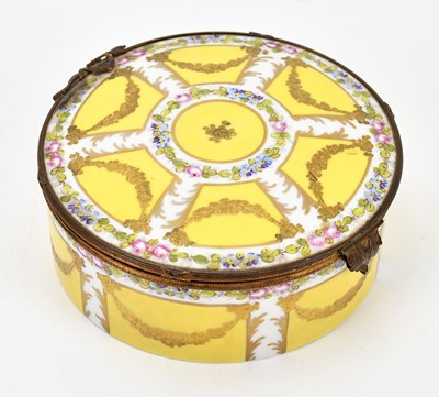 Lot 1370 - SEVRES; a hand painted yellow ground trinket...