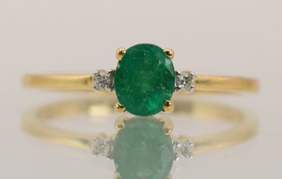 Lot 1438 - An 18ct yellow gold emerald and diamond set...