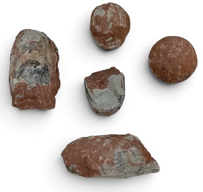 Lot 377 - Five assorted dinosaur eggs, comprising three...