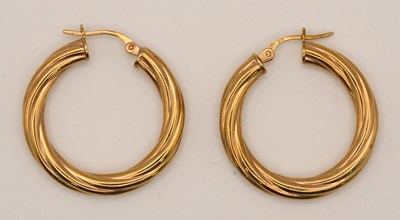 Lot 1510 - A pair of 9ct yellow gold twist hoop earrings,...