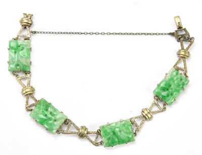 Lot 569 - A Chinese white metal and green hardstone...