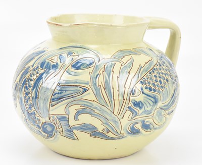 Lot 390 - CHARLES BRANNAM; a Brannam ware jug of large...