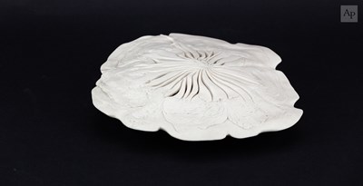 Lot 378 - MAGGIE BARNES (born 1940); a carved porcelain...