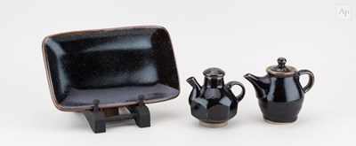 Lot 694 - A small Japanese stoneware teapot, hot water...