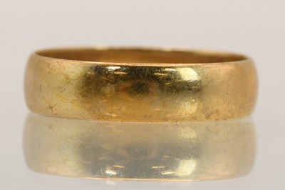 Lot 1443 - A 9ct yellow gold band ring, size R, approx...