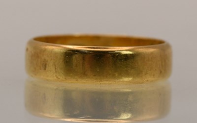 Lot 1386 - An 18ct yellow gold band ring, size L, approx...
