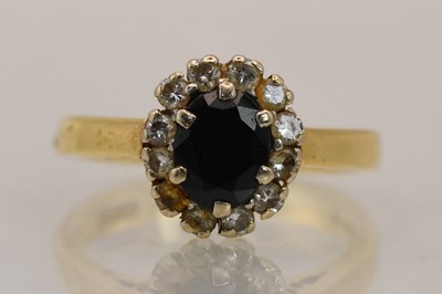Lot 1417 - An 18ct yellow gold ring with central claw set...