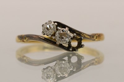 Lot 1418 - An 18ct yellow gold diamond crossover ring,...