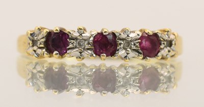 Lot 1442 - An 18ct yellow gold ruby and diamond set ring,...