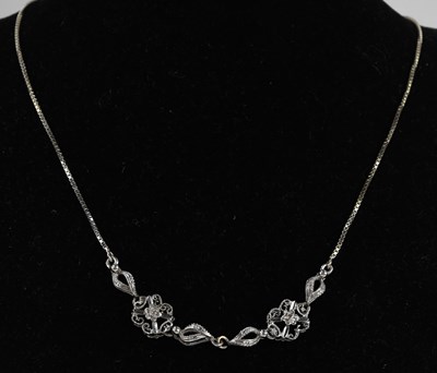 Lot 1470 - An 18ct (750) white gold necklace comprising...