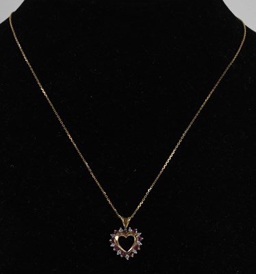 Lot 1491 - A 9ct yellow gold heart shaped open pendant,...