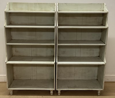 Lot 609 - A pair of painted five shelf open bookcases,...