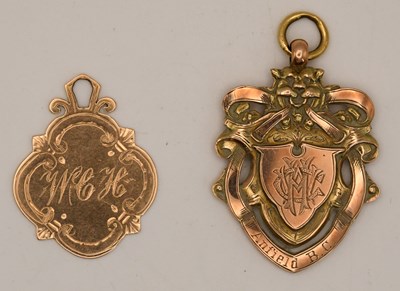 Lot 1335 - Two 9ct prize fob medals, one rose gold and...