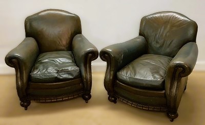Lot 590 - A pair of leather club chairs with metal stud...