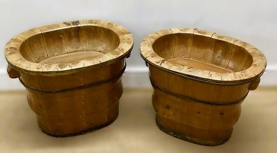 Lot 643 - A pair of oval veneered wine coolers with drop...