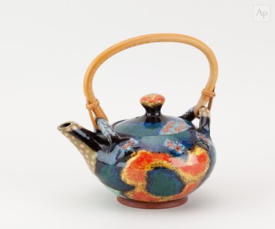 Lot 338 - JOHN POLLEX (born 1941); a slipware teapot...