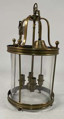Lot 578 - A brass and glass circular four branch ceiling...