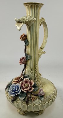 Lot 217 - A majolica style decorative floral jug, height...