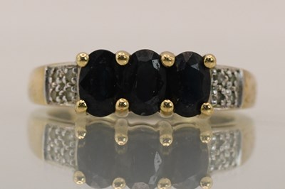 Lot 1429 - A 9ct yellow gold dress ring, with three oval...