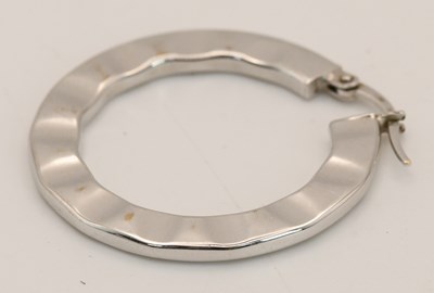 Lot 1502 - An 18ct white gold hoop earring, diameter...