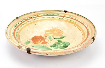 Lot 1351 - A large Continental tin glazed earthenware...