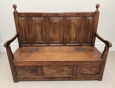 Lot 49 - An 18th century and later oak settle, with...
