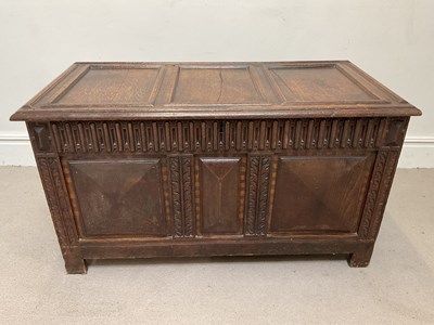 Lot 54 - An 18th century oak coffer with hinged lid and...
