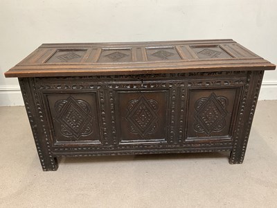 Lot 52 - An18th century oak coffer with lozenge carved...