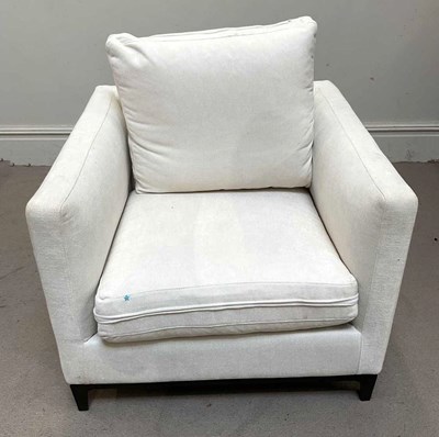 Lot 34 - A contemporary white upholstered armchair.