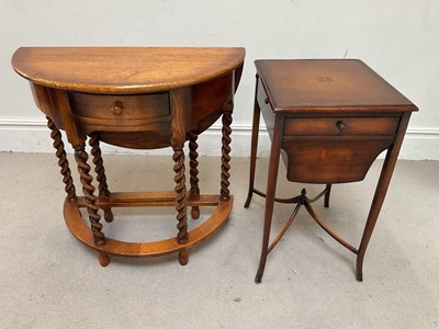 Lot 130 - An oak drop lead side table, with drawer, on...