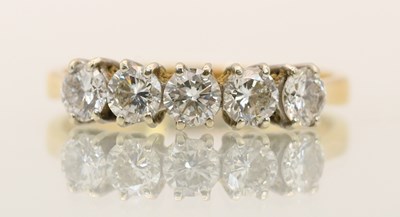 Lot 1357 - An 18ct yellow gold diamond set five stone...