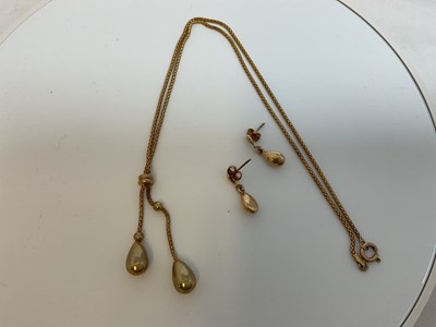 Lot 595 - A 9ct yellow gold necklace and earrings marked...