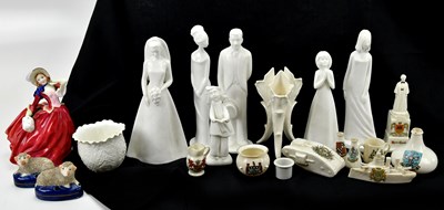 Lot 1372 - A collection of decorative ceramic figures...