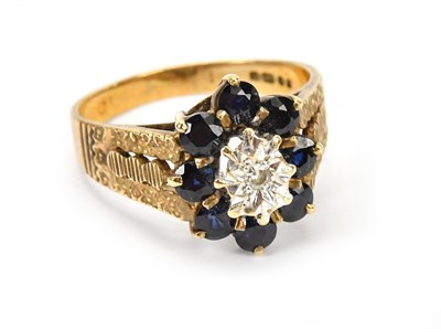 Lot 586 - A 9ct yellow gold dress ring set with clear...