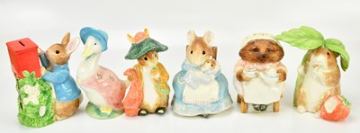 Lot 1299 - BEATRIX POTTER; six large sized money boxes by...