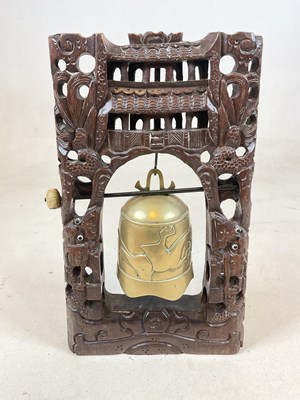 Lot 602 - An Oriental table gong, with hard wood carved...