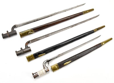 Lot 1077 - Three late 19th century socket bayonets,...